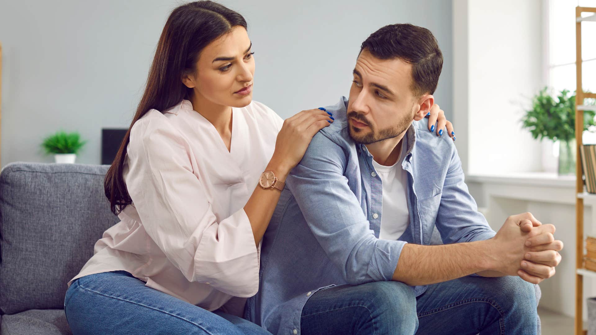 woman giving apology and comforting her husband
