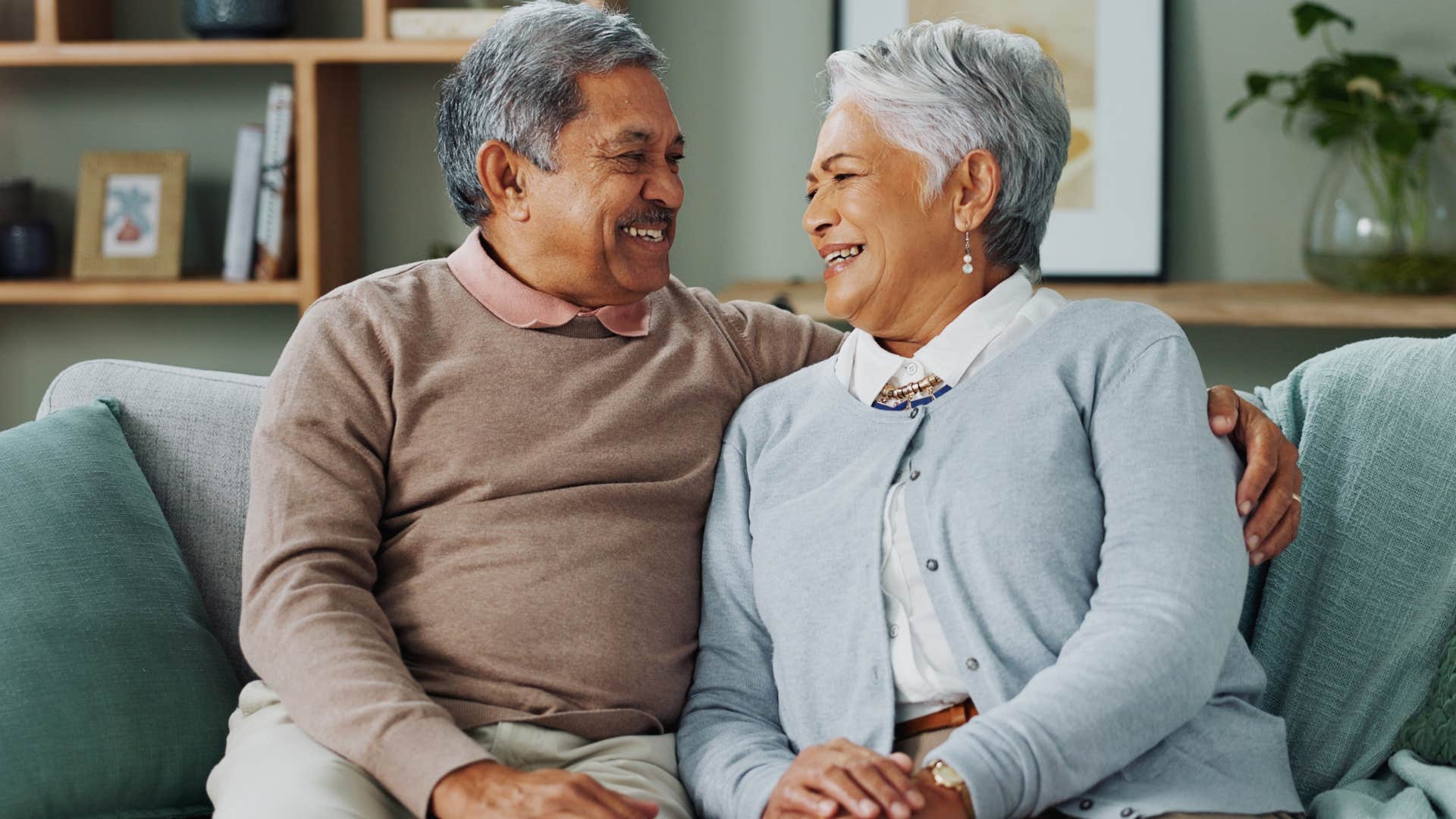 loyal couple smiling sitting together