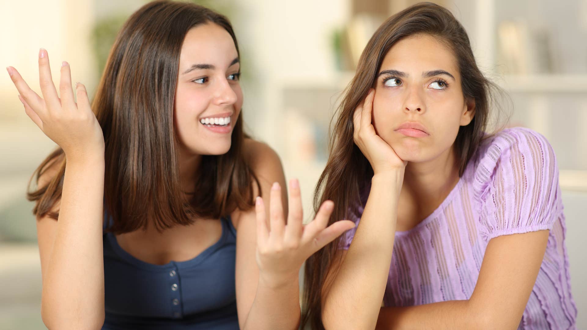 Annoyed woman turned away from her friend making jokes about mental illness 