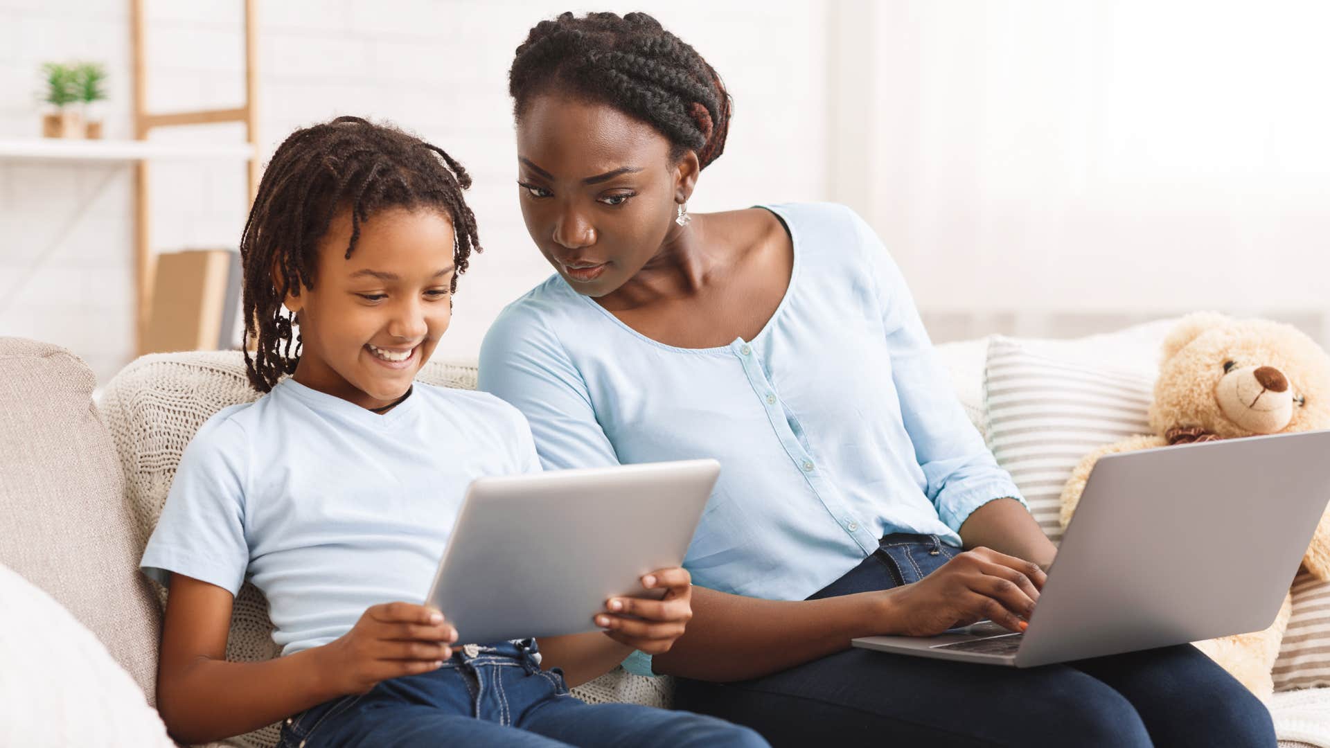 a mother is surprised at how well her son is using technology at such a young age