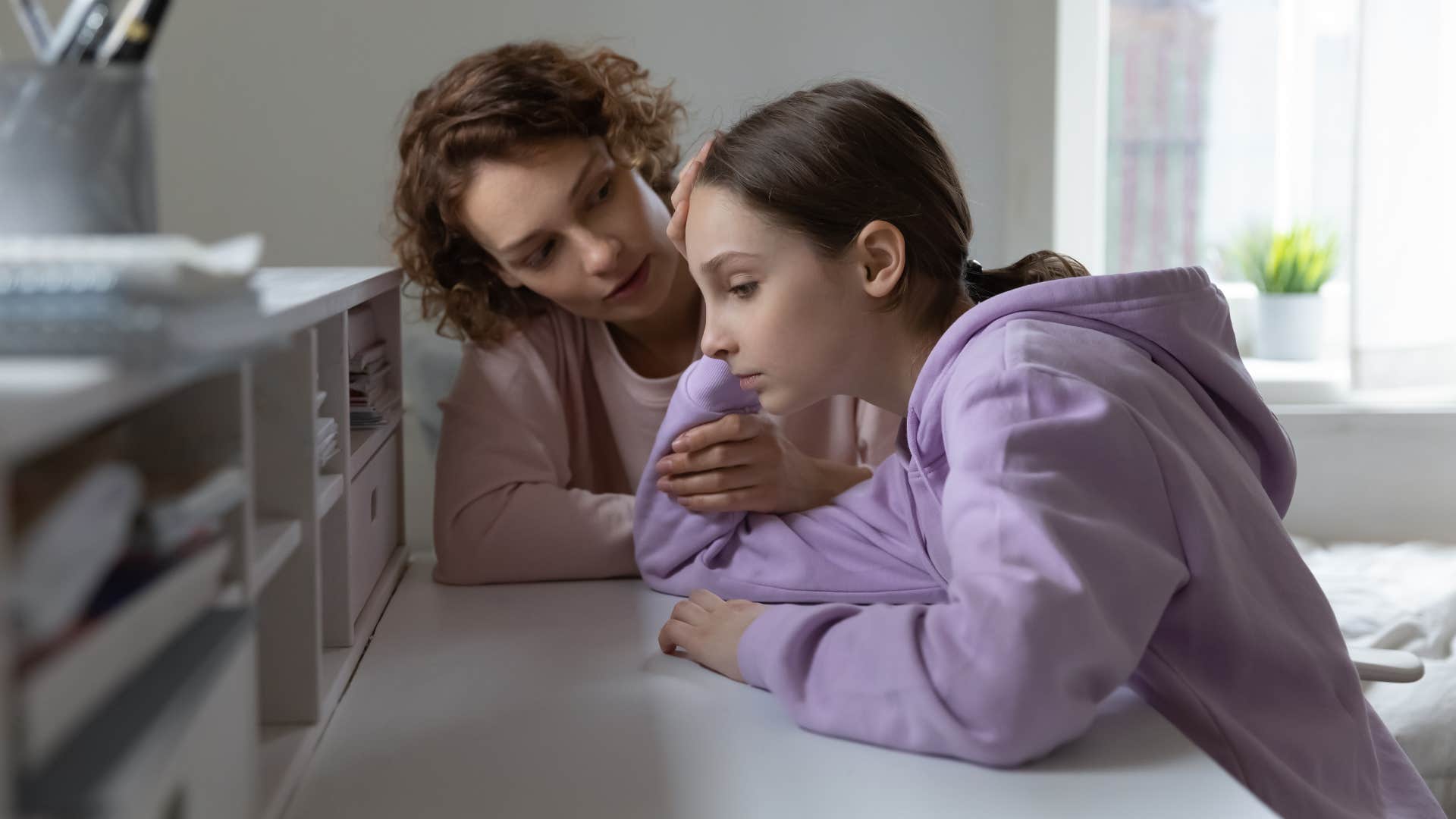a mother apologizes to her daughter after saying something triggering to her