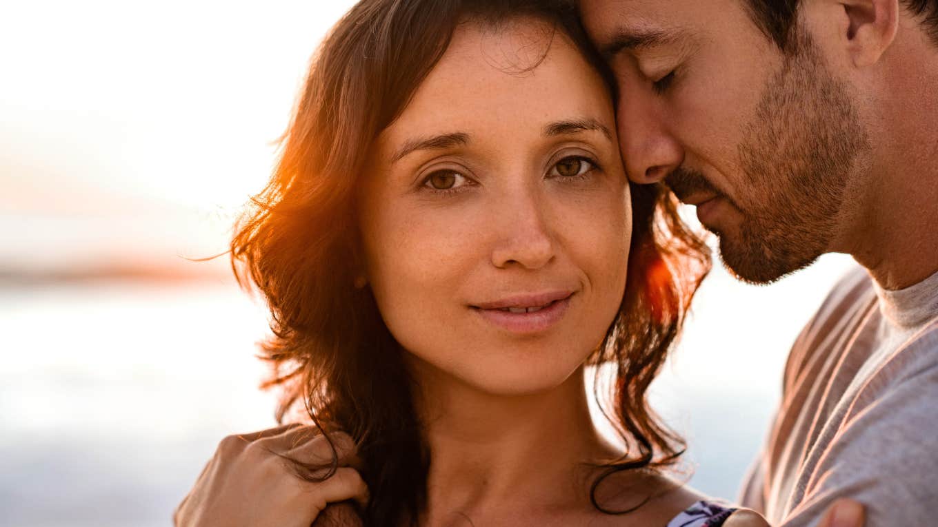 brilliant woman standing next to her man in happy relationship