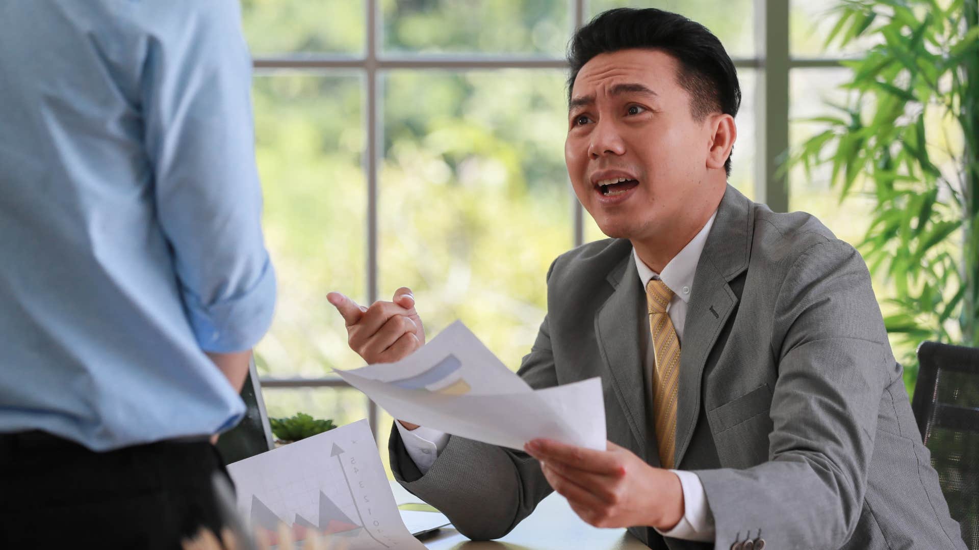 Man who's constantly complaining yelling at a co-worker.
