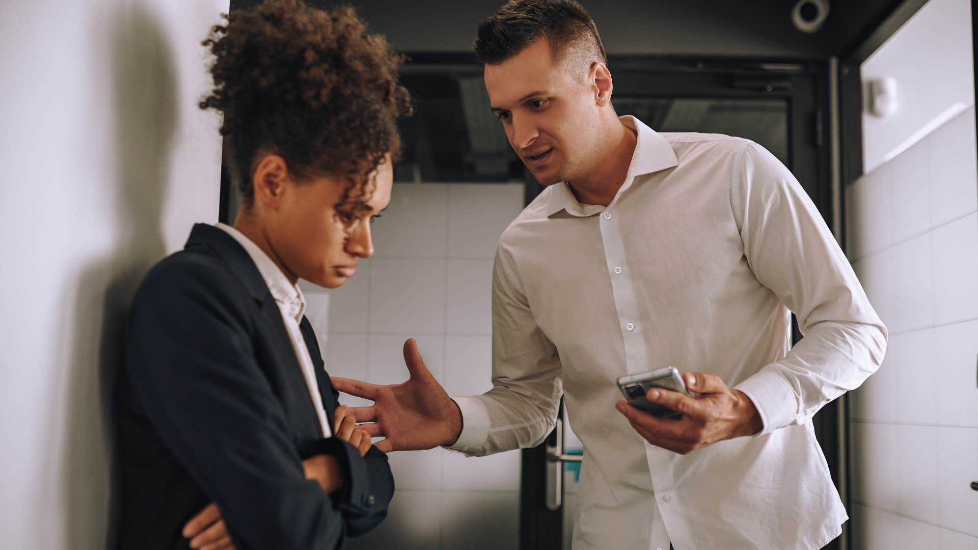 Man overlooking humanity for productivity and arguing with a co-worker.