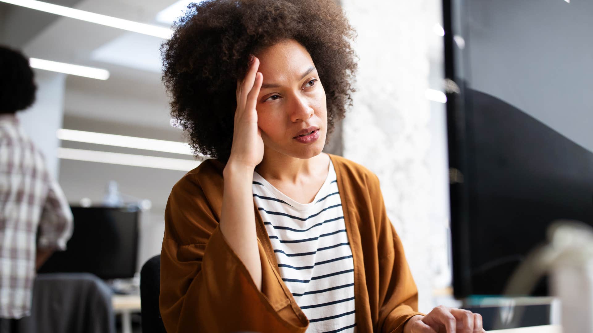 Woman not taking responsibility for mistakes and looking at her laptop.