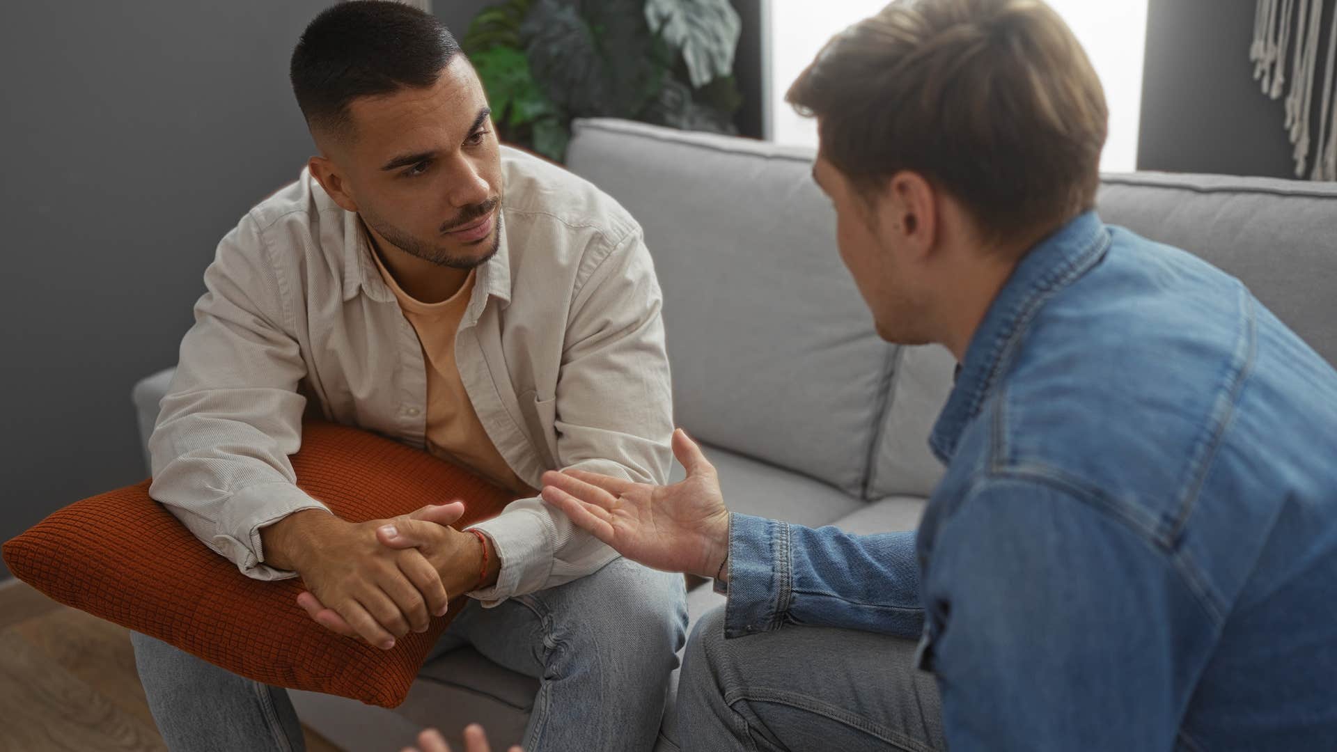 man telling friend that expressing pain doesnt make him ungrateful