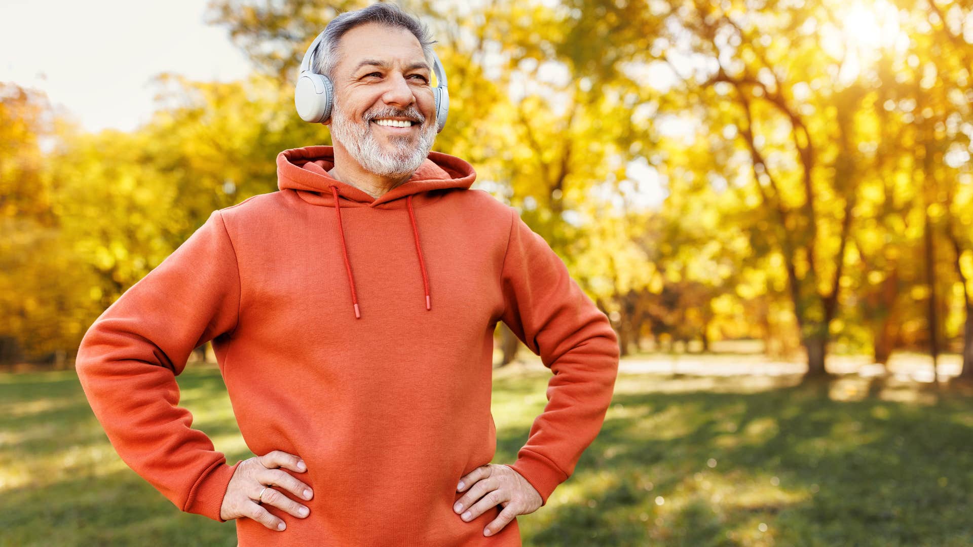smiling man pretending to like fitness trend of running