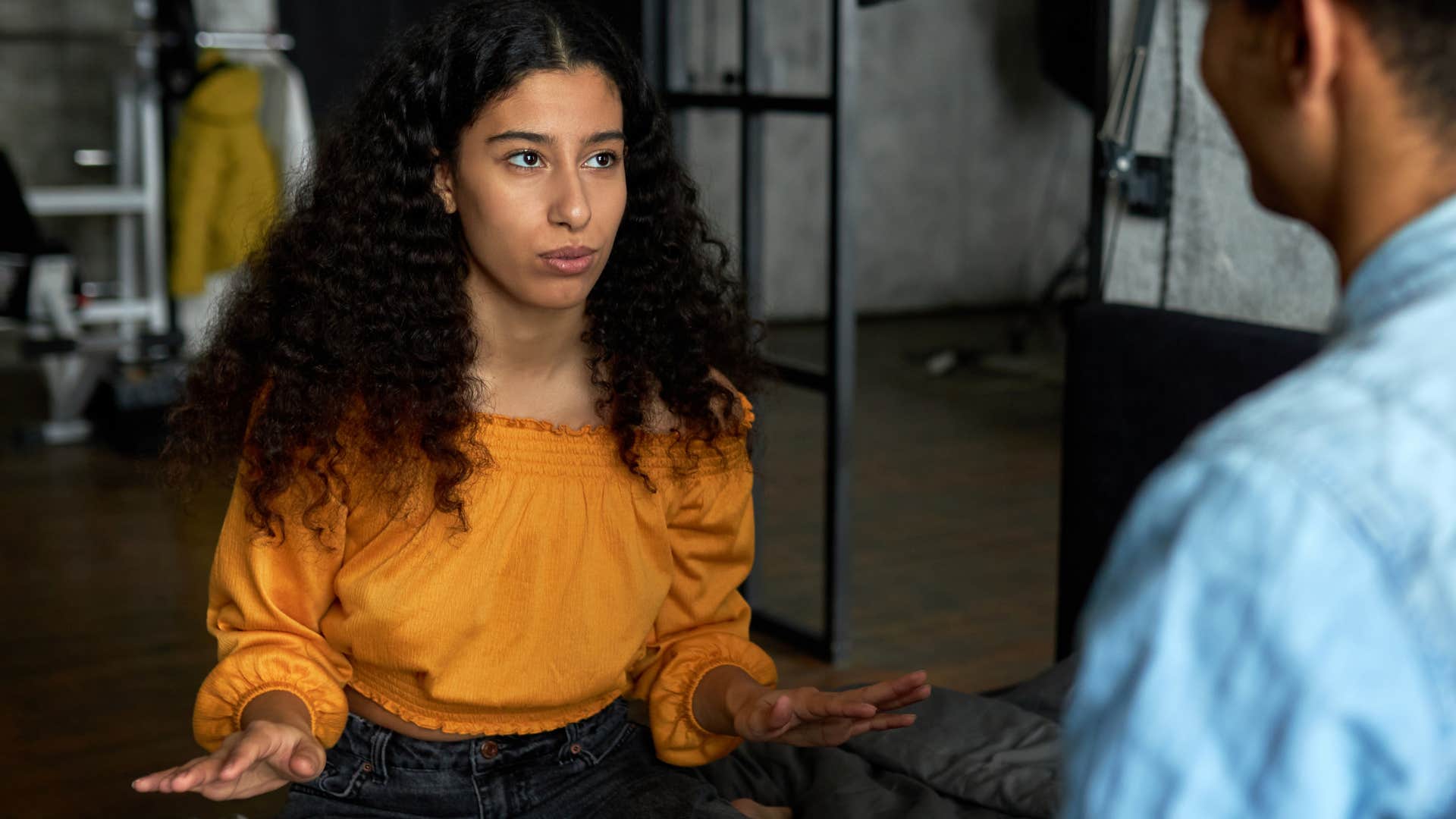 woman talking to man making fun of mental health