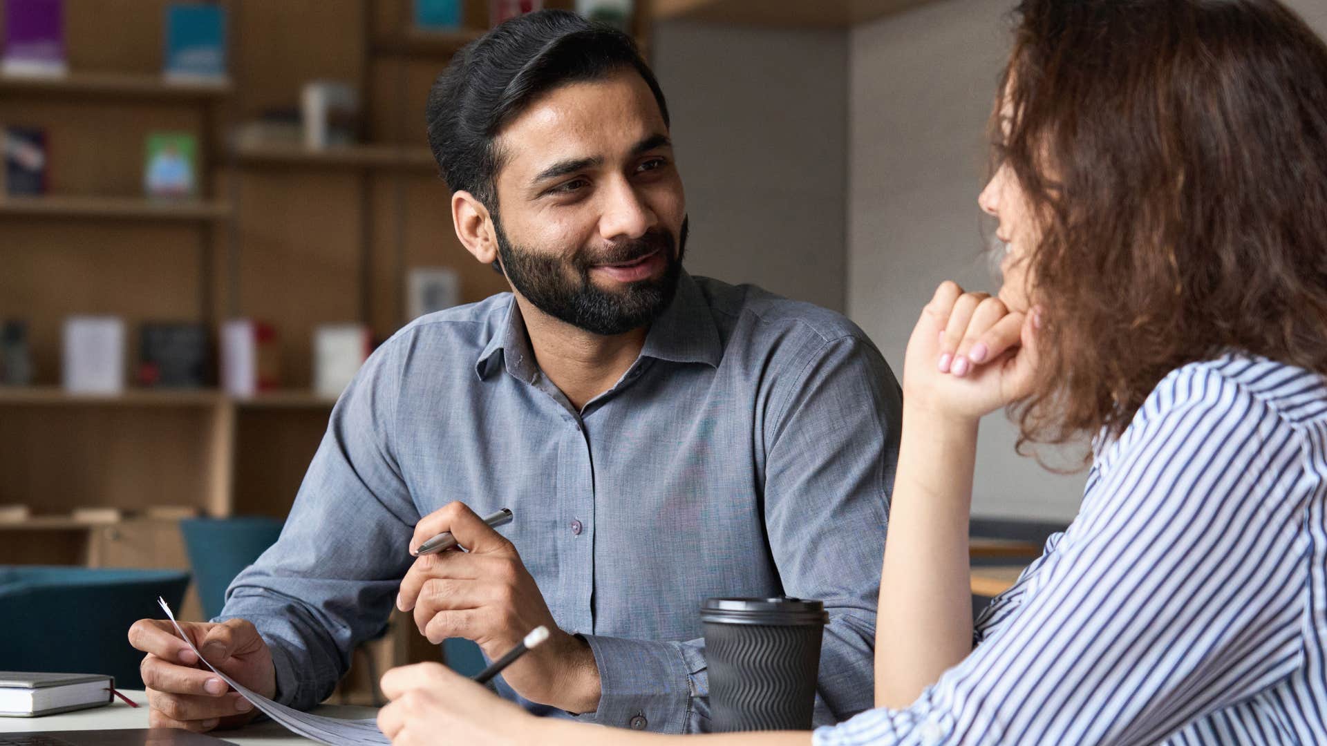 man pretending to enjoy solving woman's problems