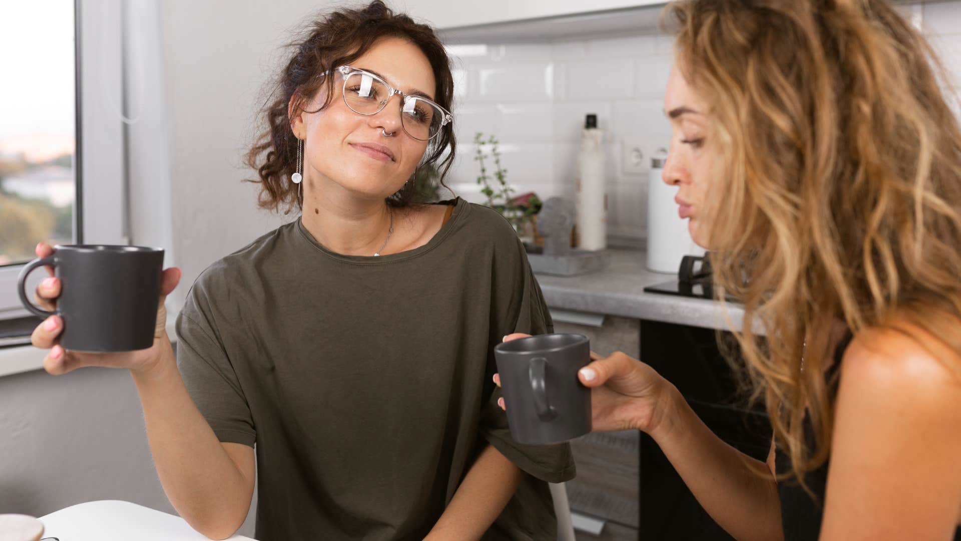 woman pretending to enjoy having superficial conversations with friend