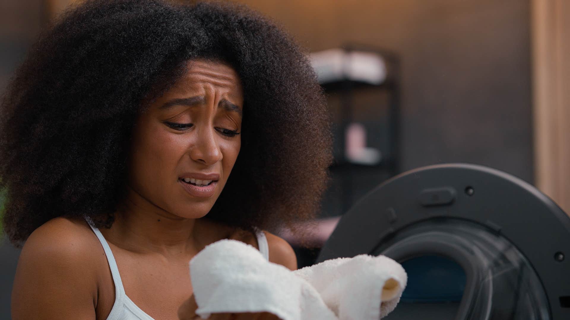 Woman with overused bathroom towel 
