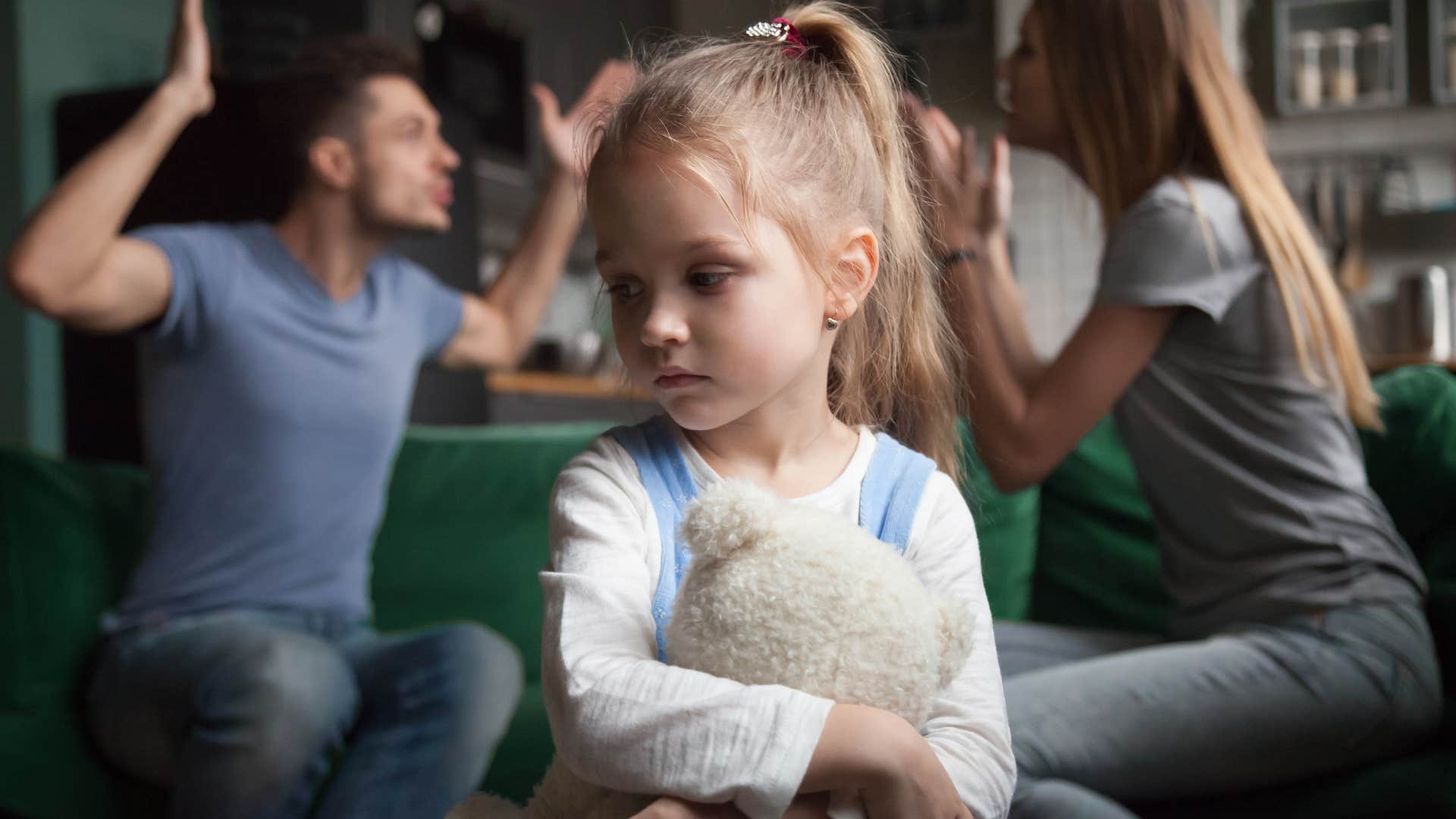 toxic parents arguing in front of scared daughter