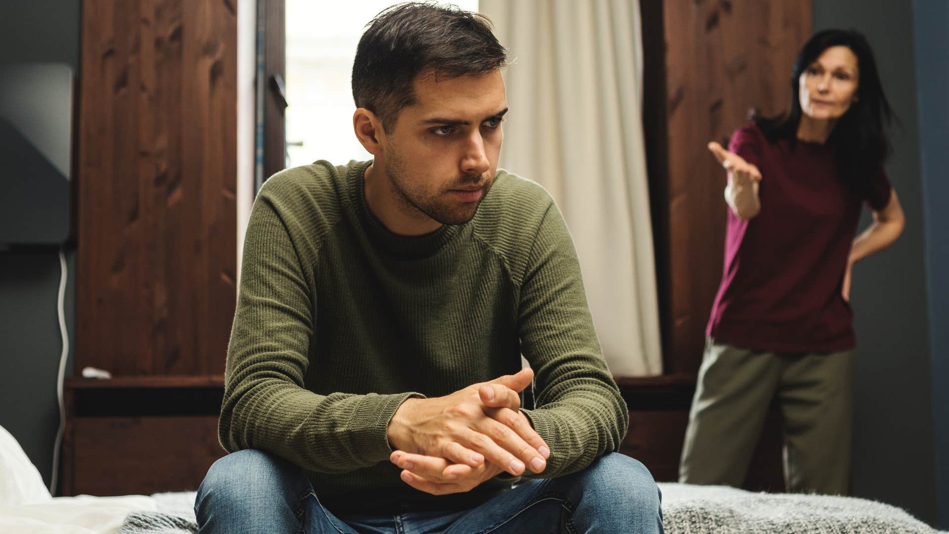 Woman overstepping boundaries and yelling at her adult son.