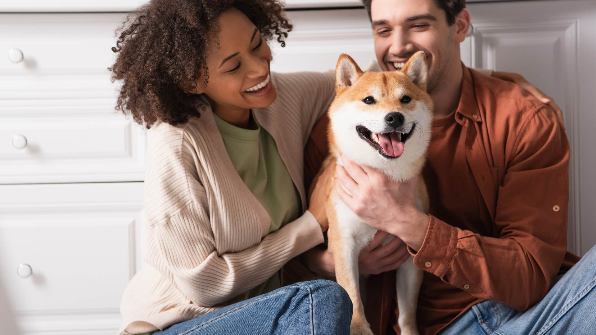 Couple pets dog before guests come over