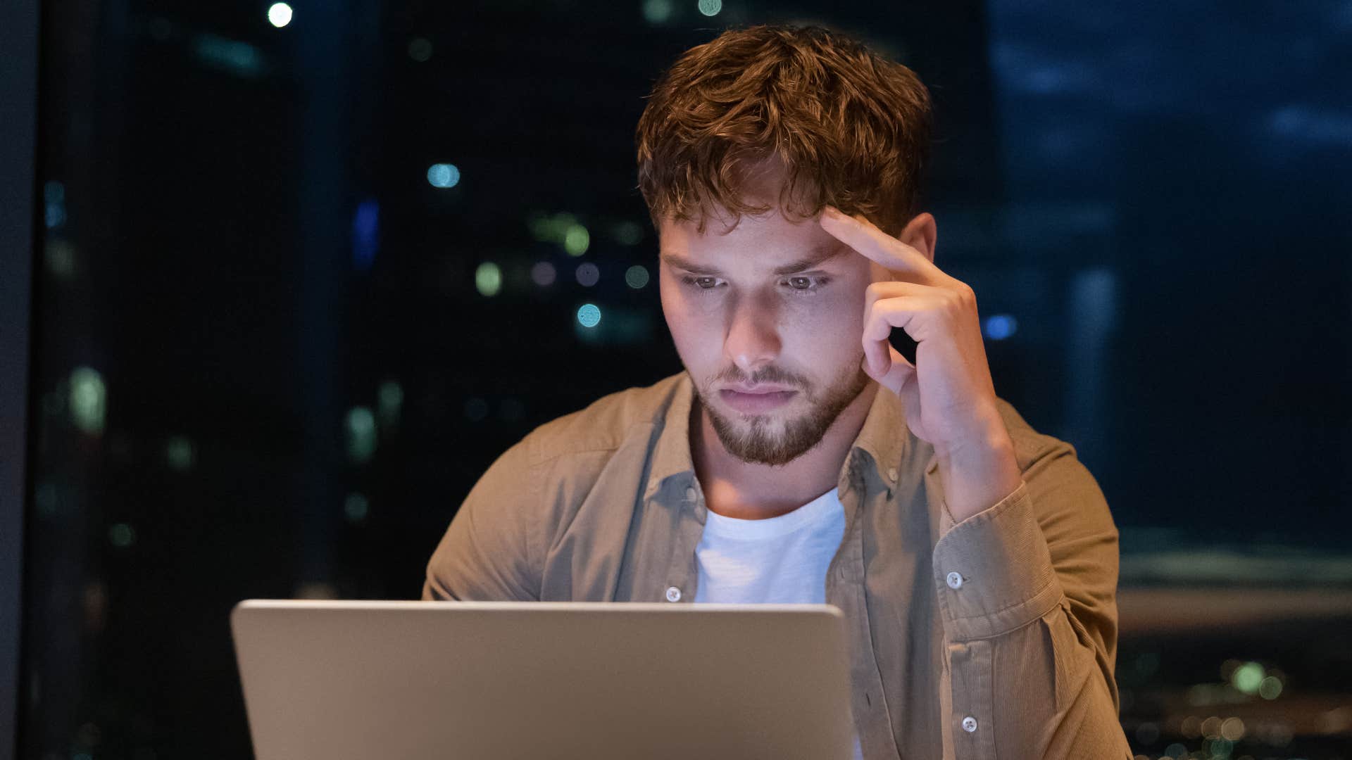 a man stays busy at work to avoid facing his emotions