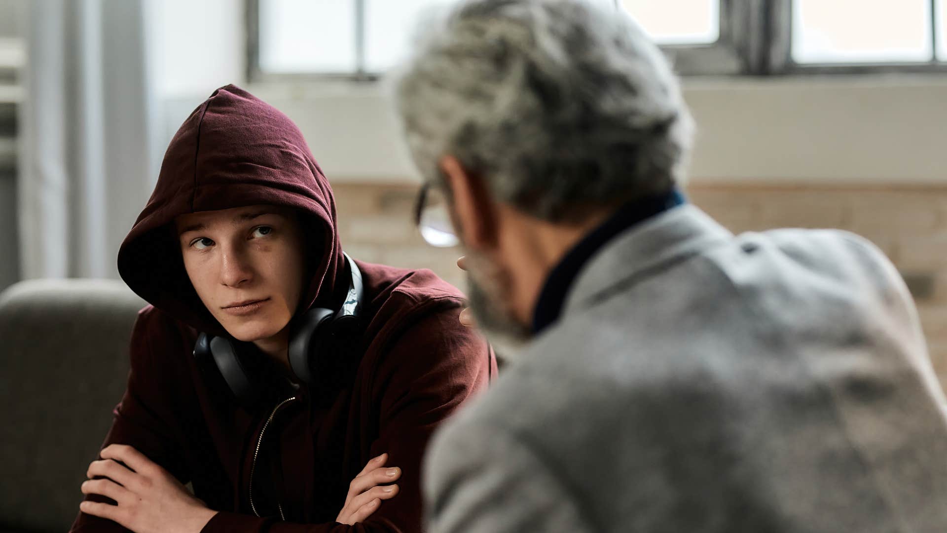 a young man gets easily irritated and defensive when his father talks to him