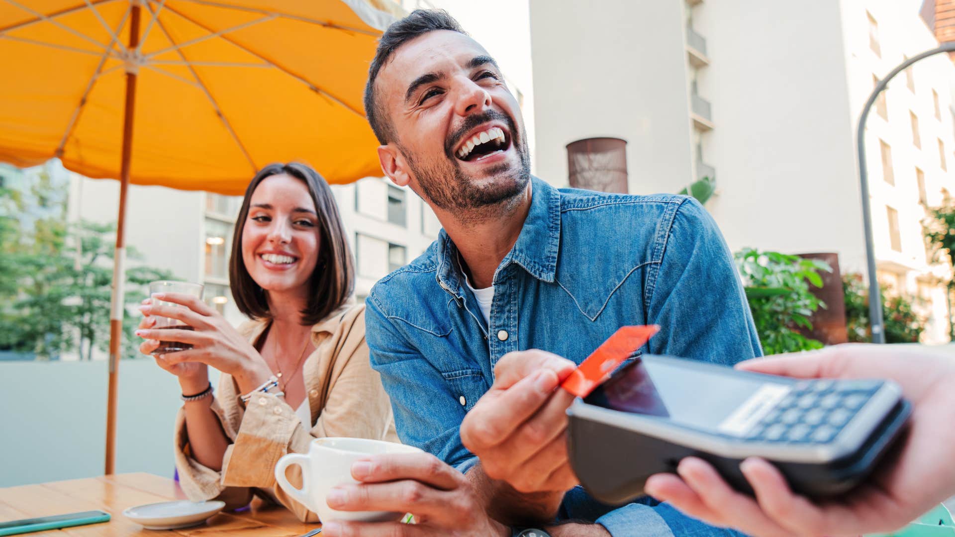 man not checking bank account before paying for meal