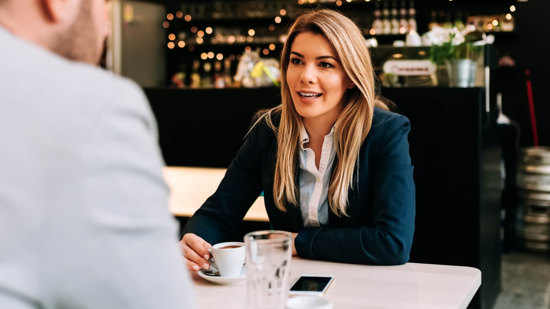wealthy woman assuming everyone has a safety net drinking coffee