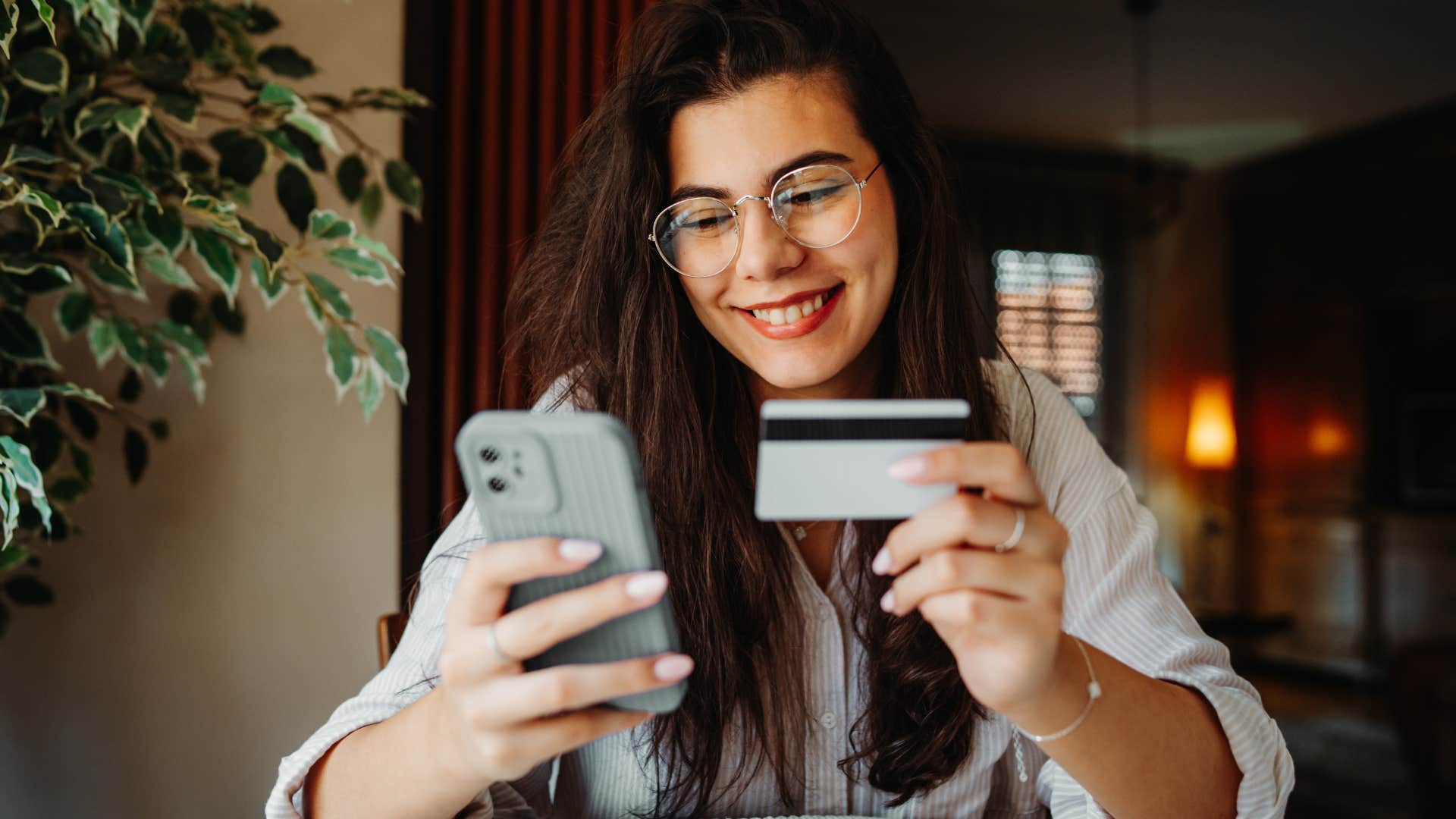 woman spending money casually while smiling