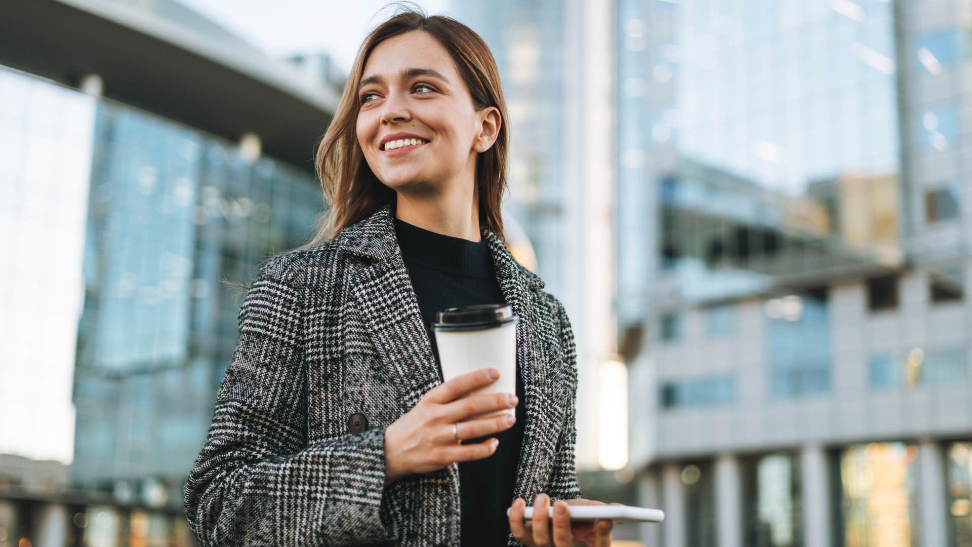 woman smiling after getting coffee