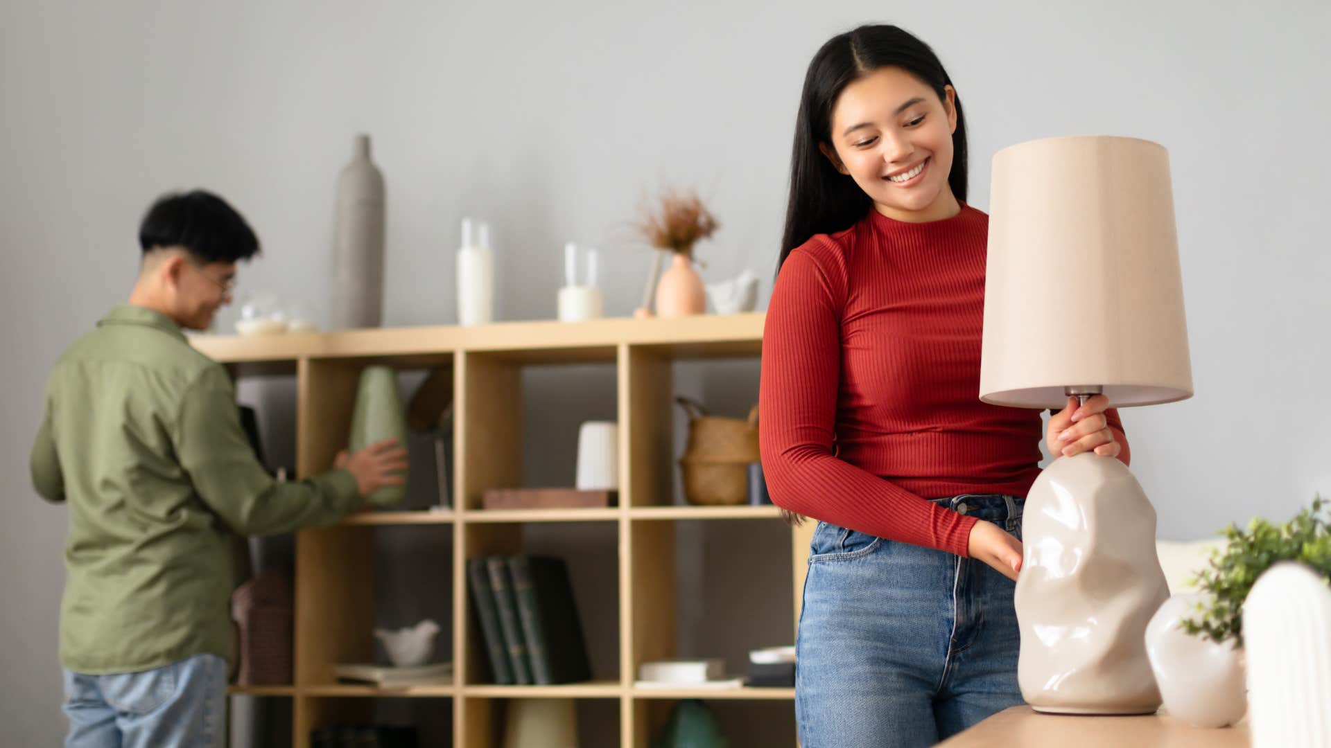 woman moving around high-end home decor