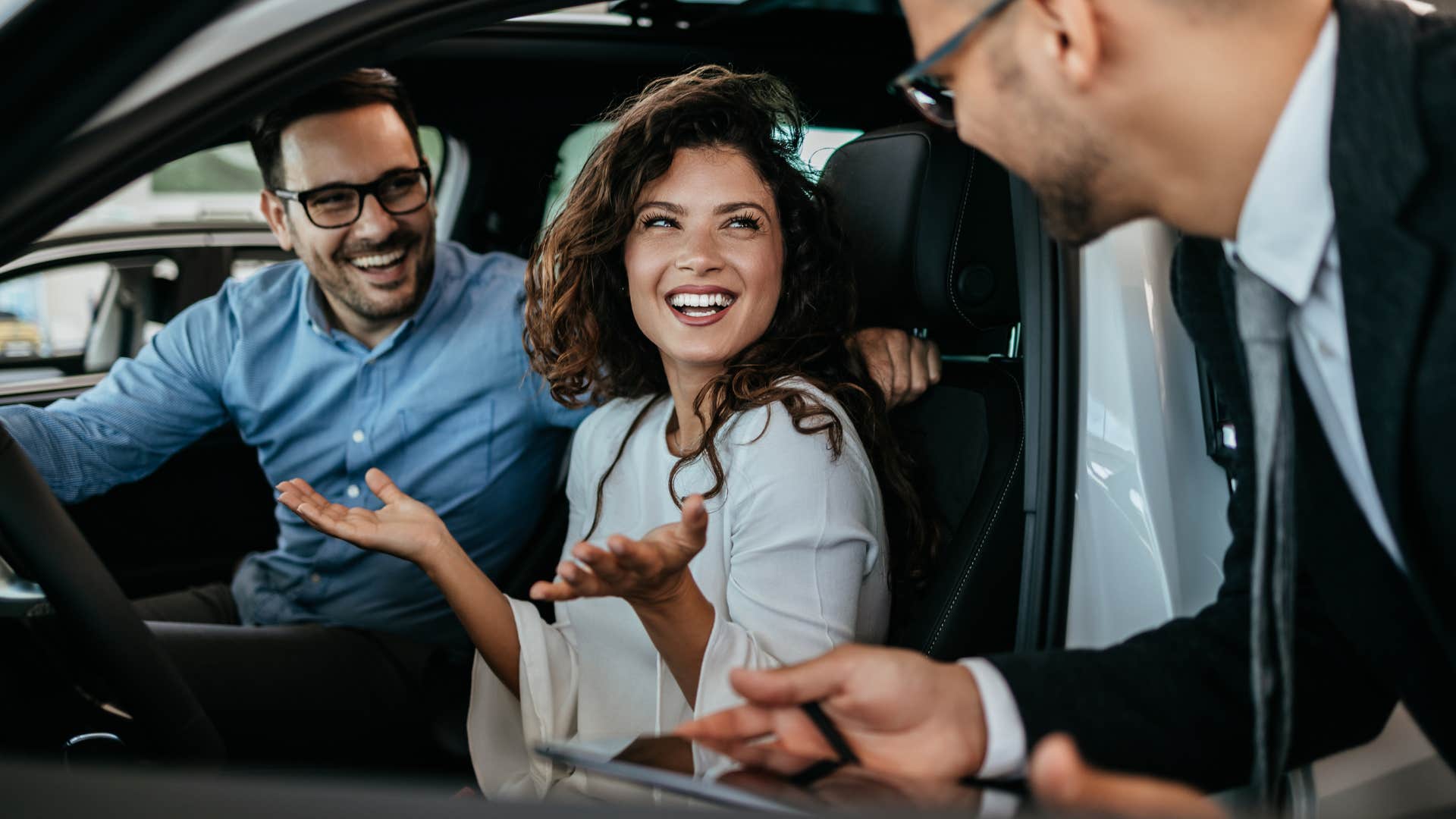 woman sitting in a luxury car