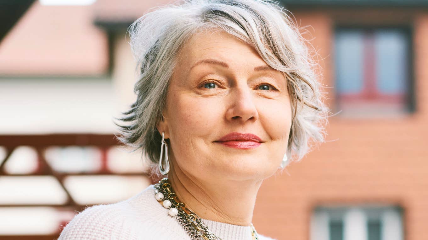 older intelligent woman with a high iq smiling