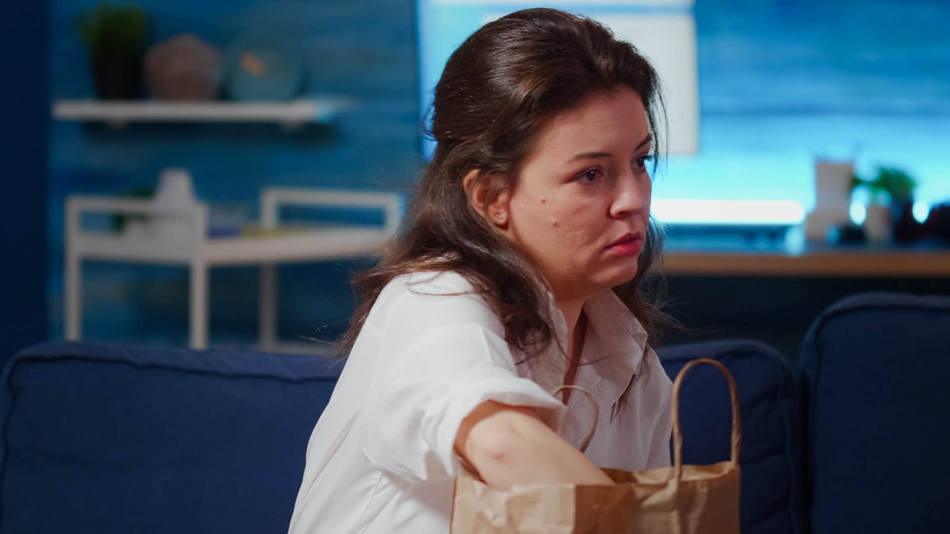 a woman intends to keep all of her takeout containers to save money on plates