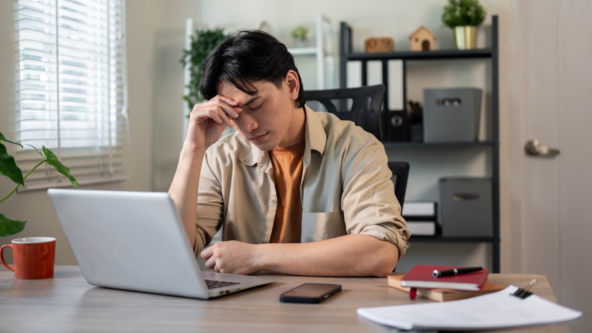 man stressed and struggling to ask for help