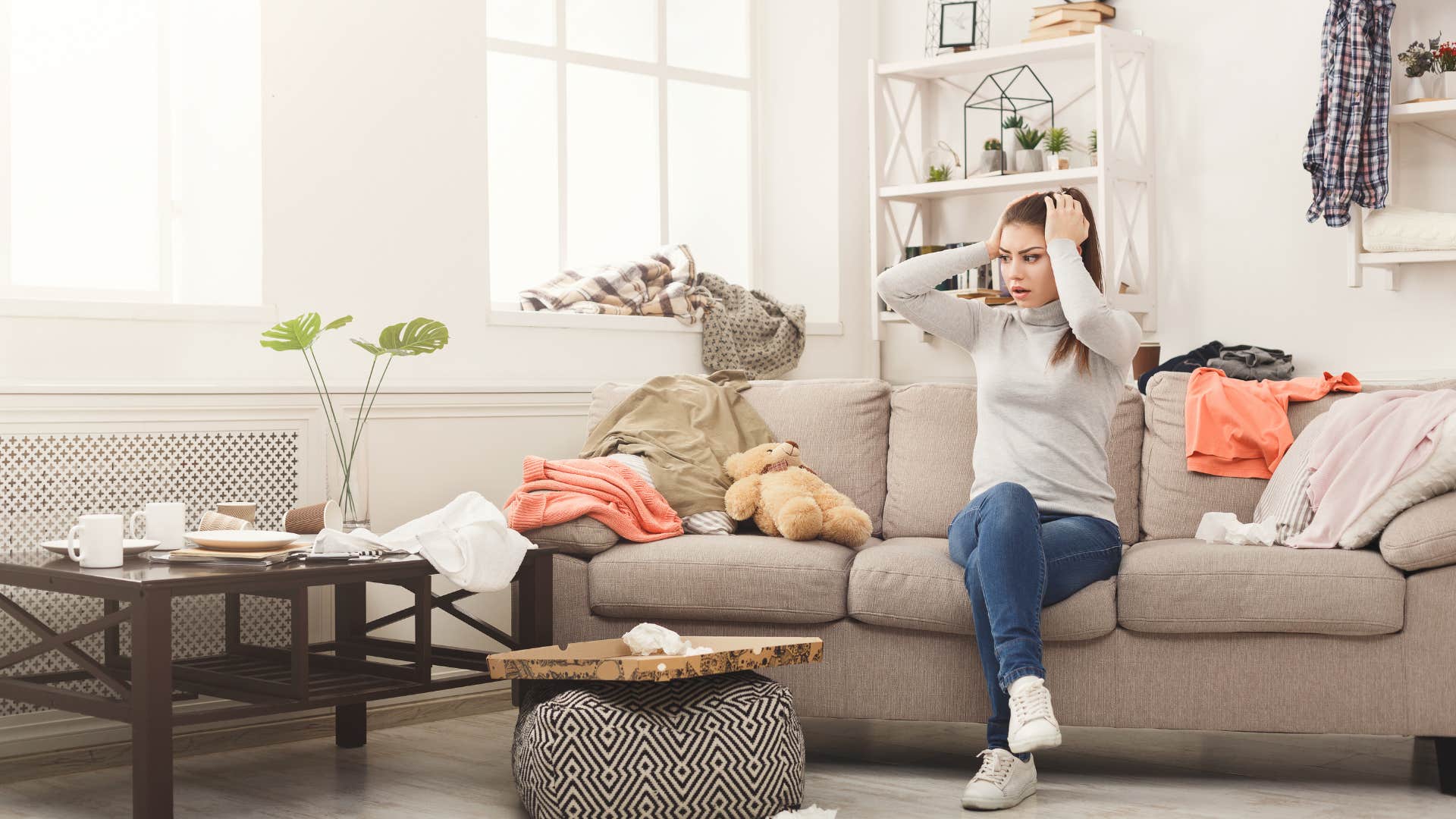 woman stressed out by clutter in home