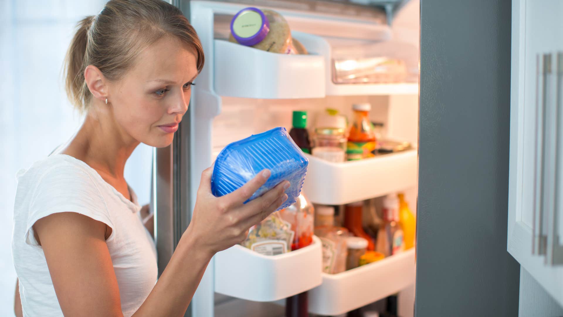 woman looking at food label
