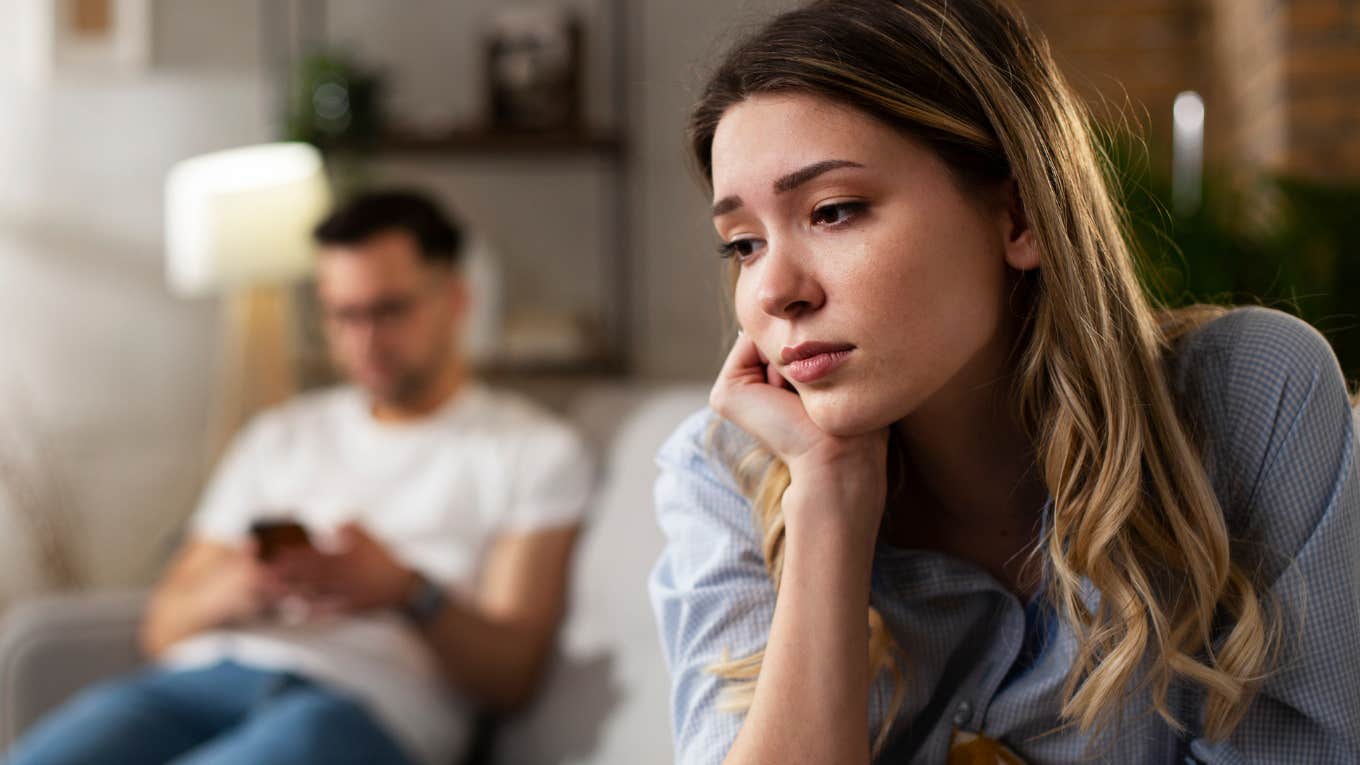 Things People Say When They're Secretly Afraid You'll Leave Them sad woman turned away from partner afraid he will leave her