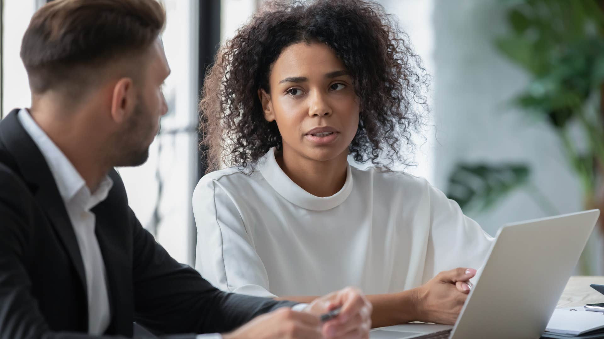 woman telling colleague everyone knows that