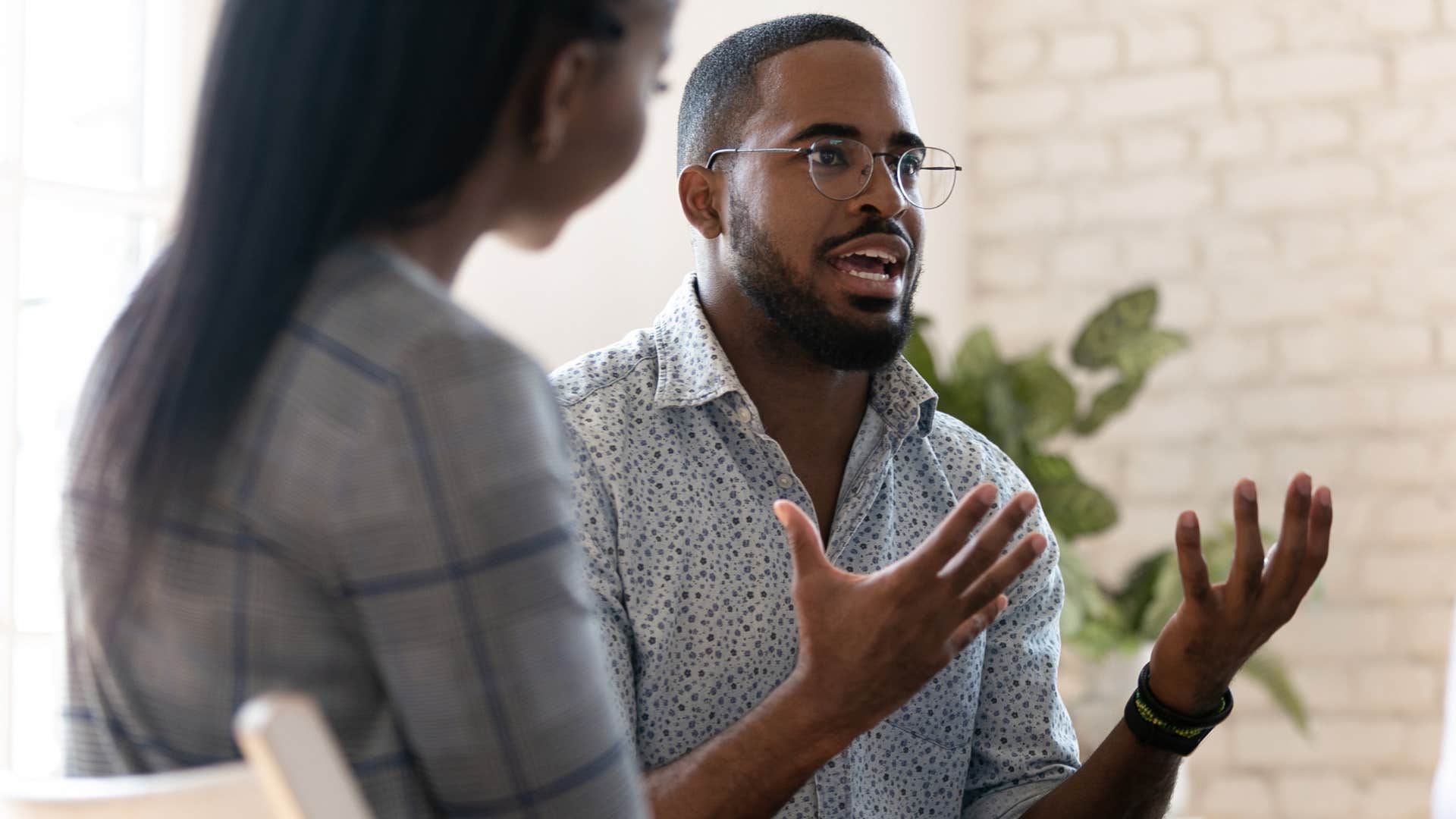 upset man saying it's self-explanatory to his co-workers