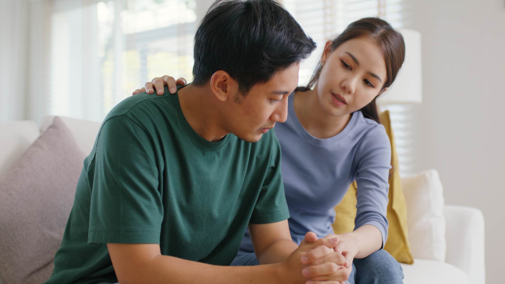 concerned woman trying to comfort partner 