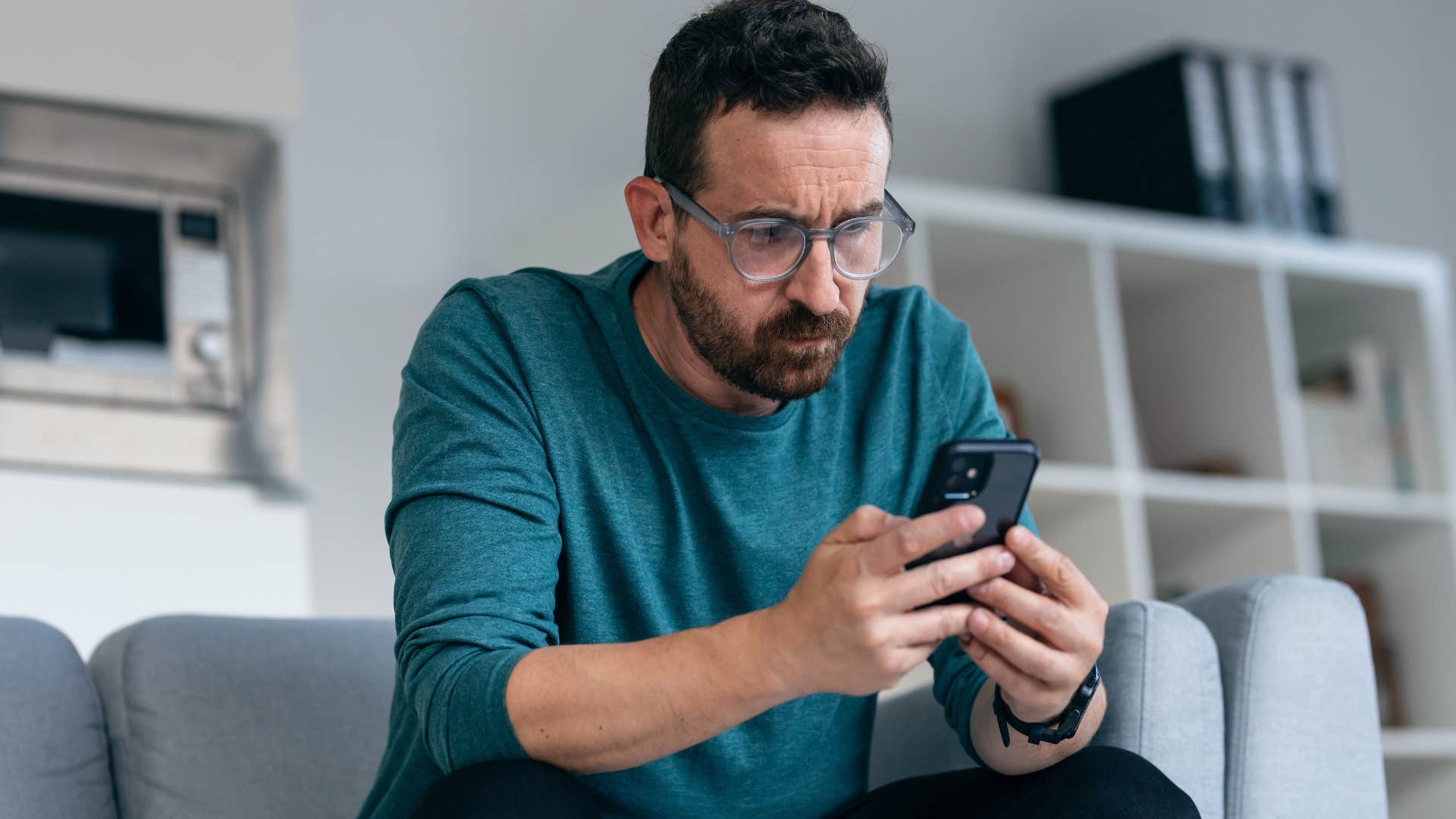 high iq man pretending to enjoy staying informed but secretly hating it