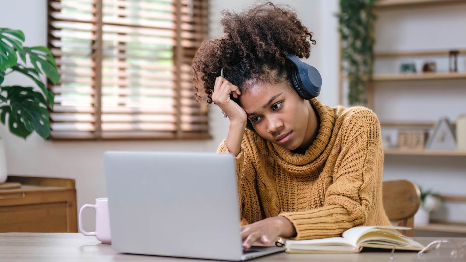 high iq woman annoyed with taking too many work meetings on her laptop