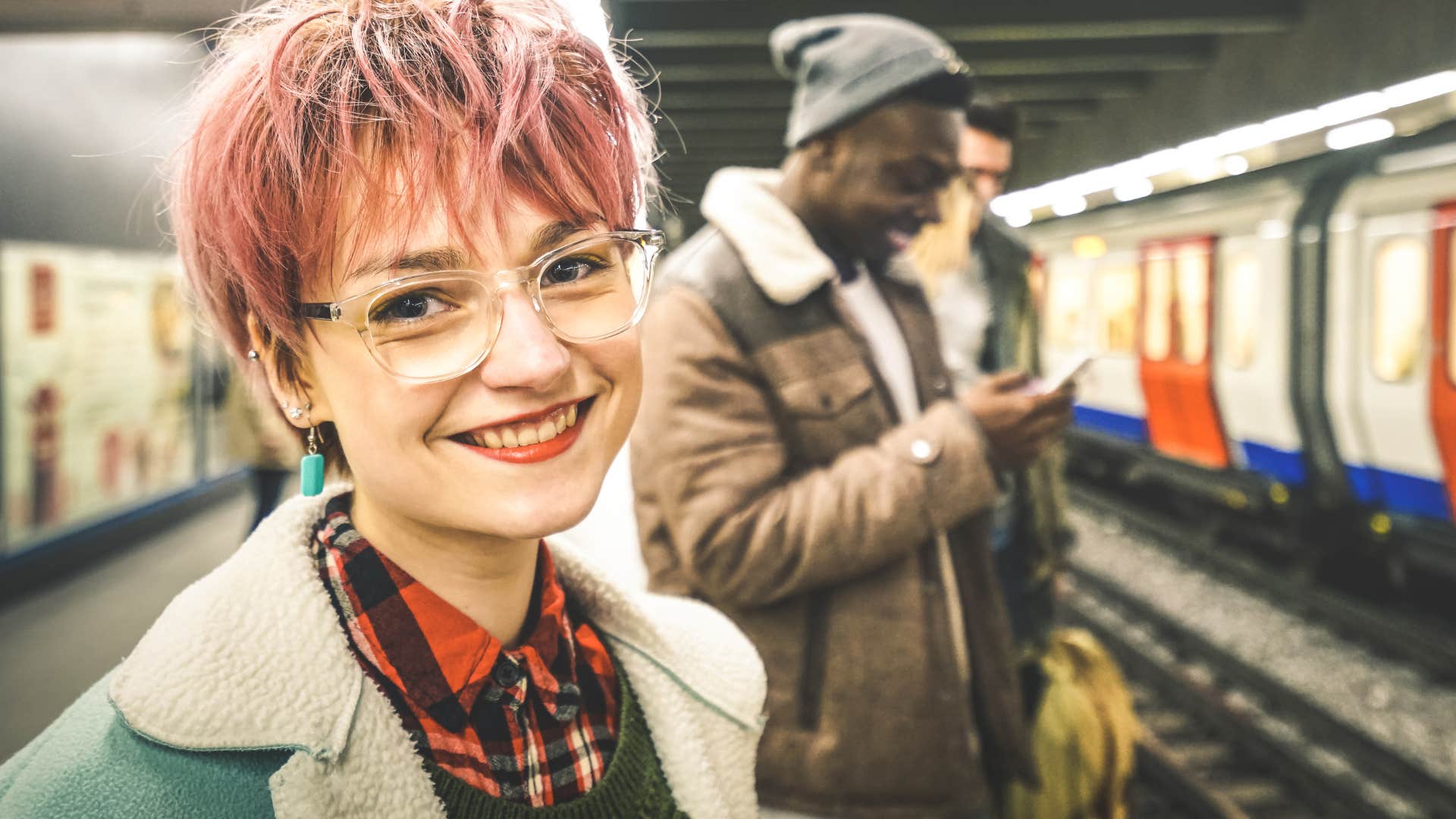 Beautiful strangers smiling at each other on the subway