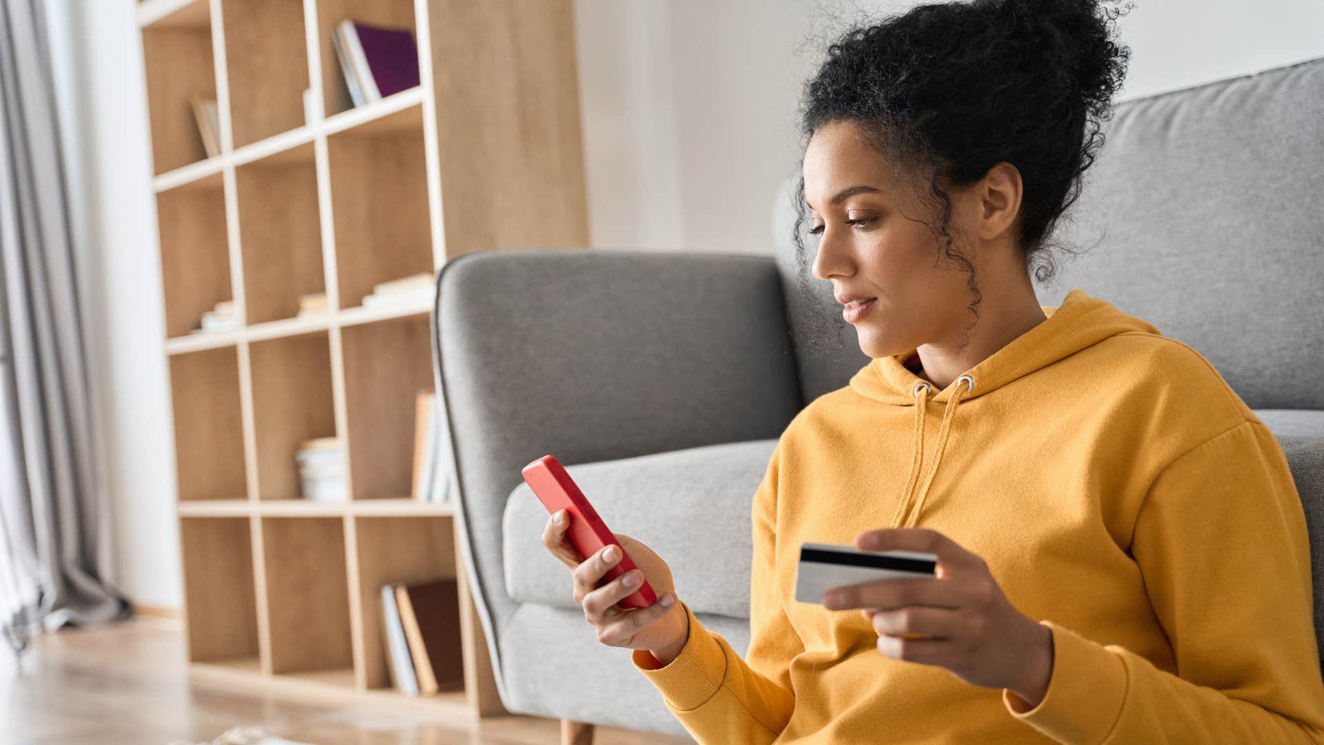 woman paying for monthly subscriptions on her phone