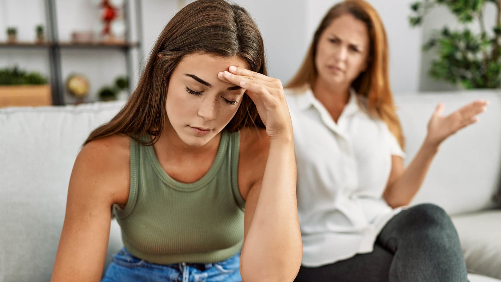 Woman being passive aggressive toward her upset adult daughter.