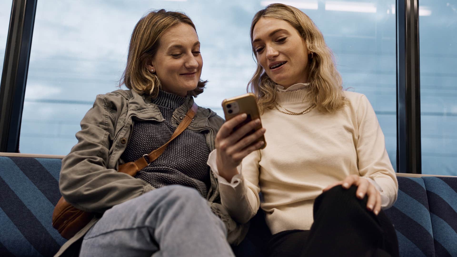women being performative with her identity showing friend her phone