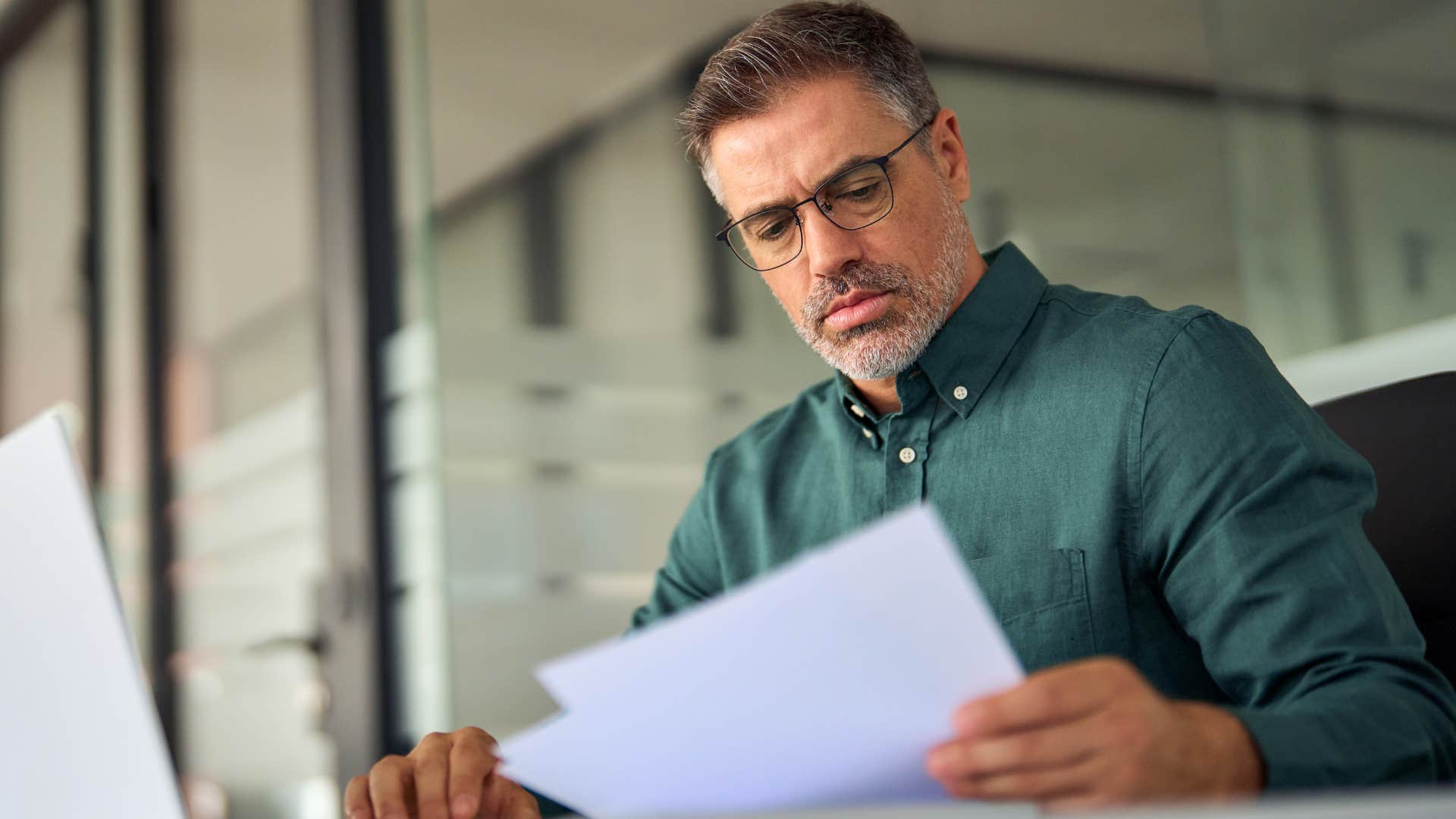 man practicing financial literacy doing his bills