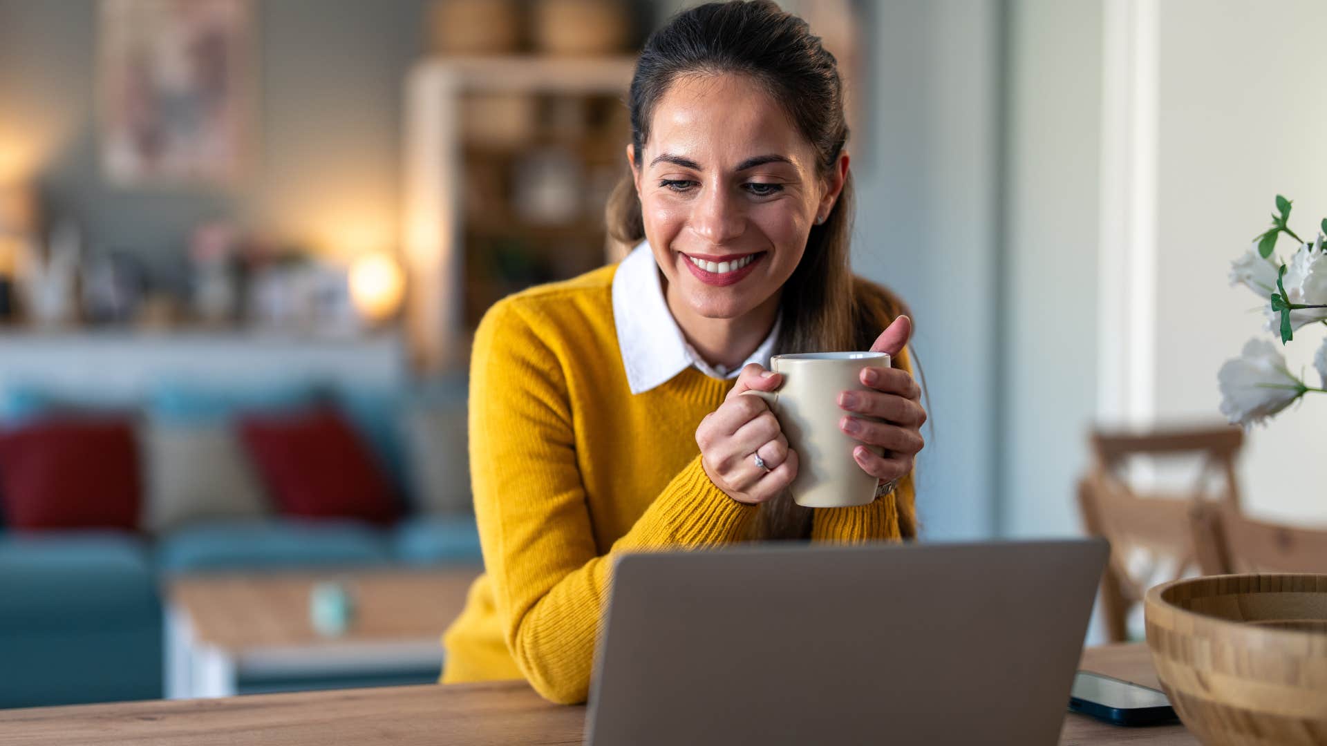 woman who knows productivity doesn't equate to self-worth working at home