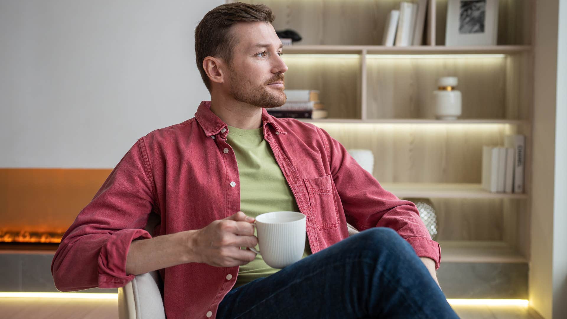 man practicing work-life balance drinking coffee at home