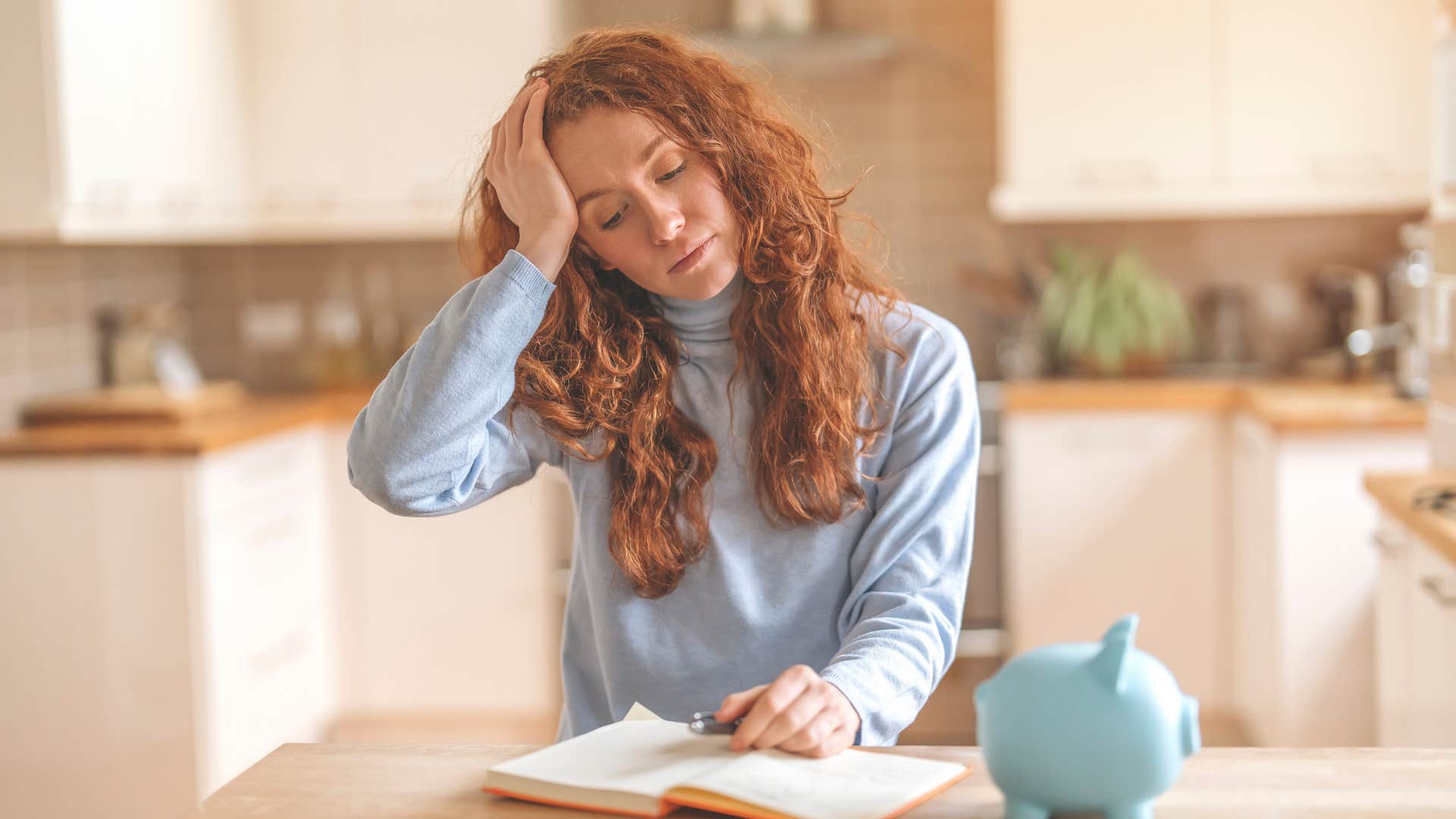 tired woman fighting sleep to get work done