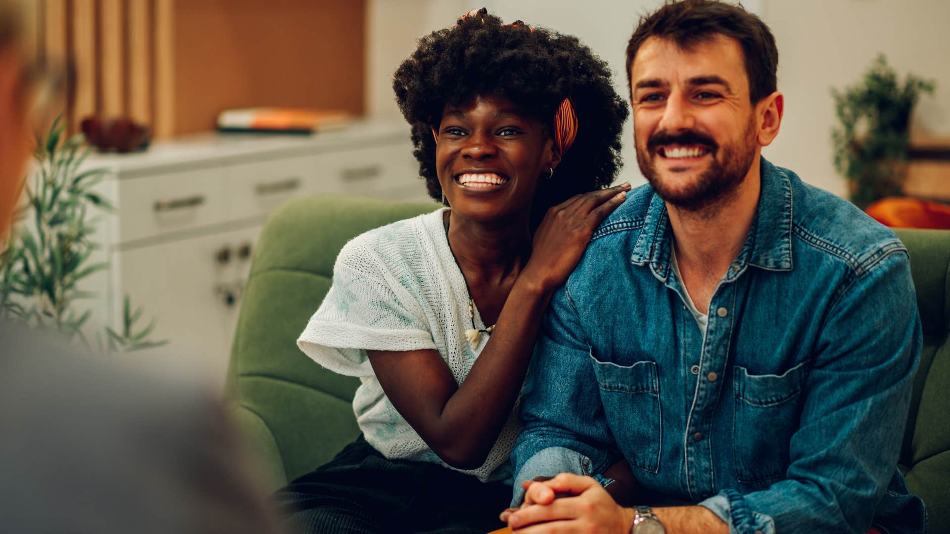 emotionally predictable man sitting next to wife in therapy