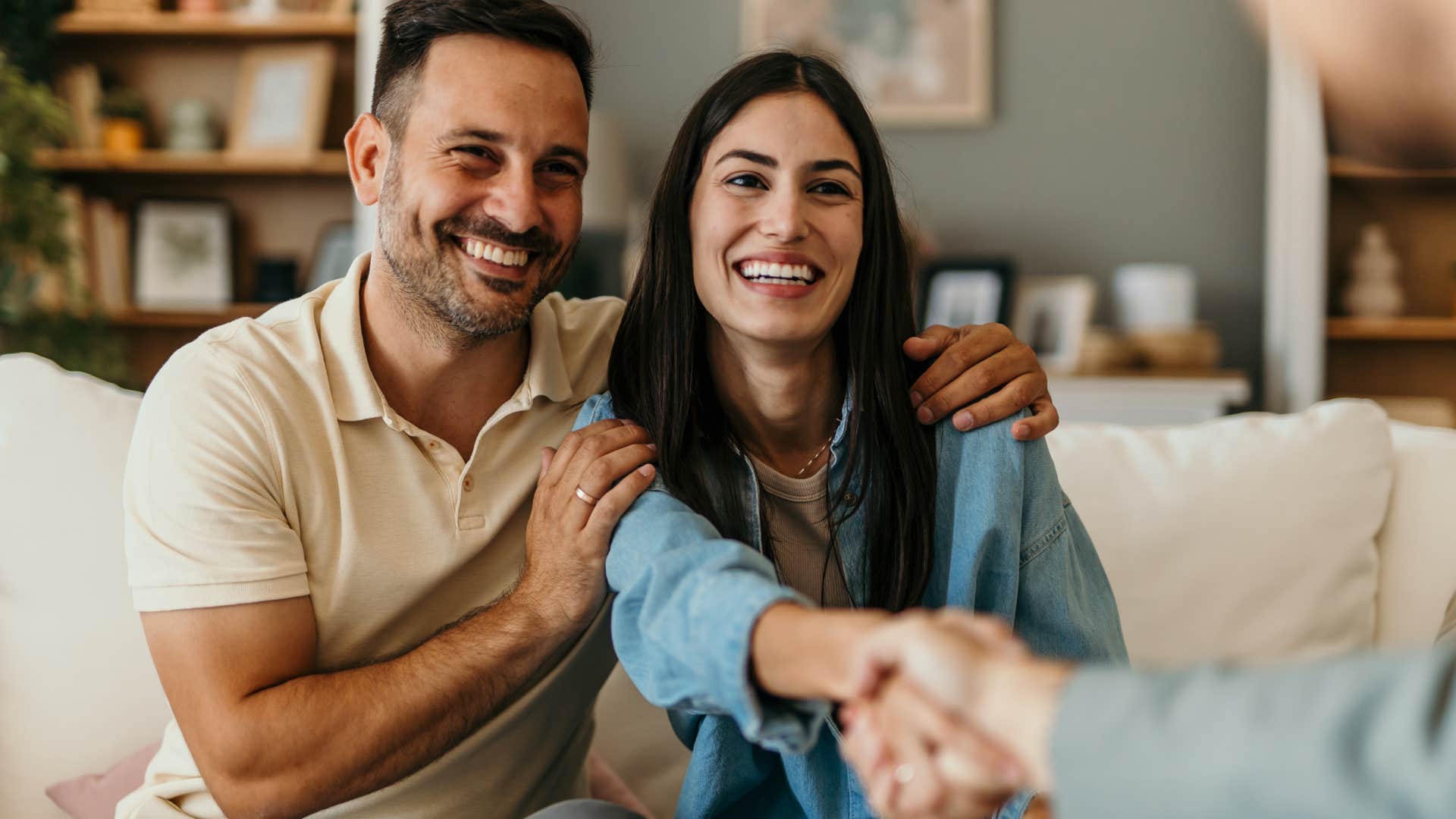 man with softened body language being supportive of woman