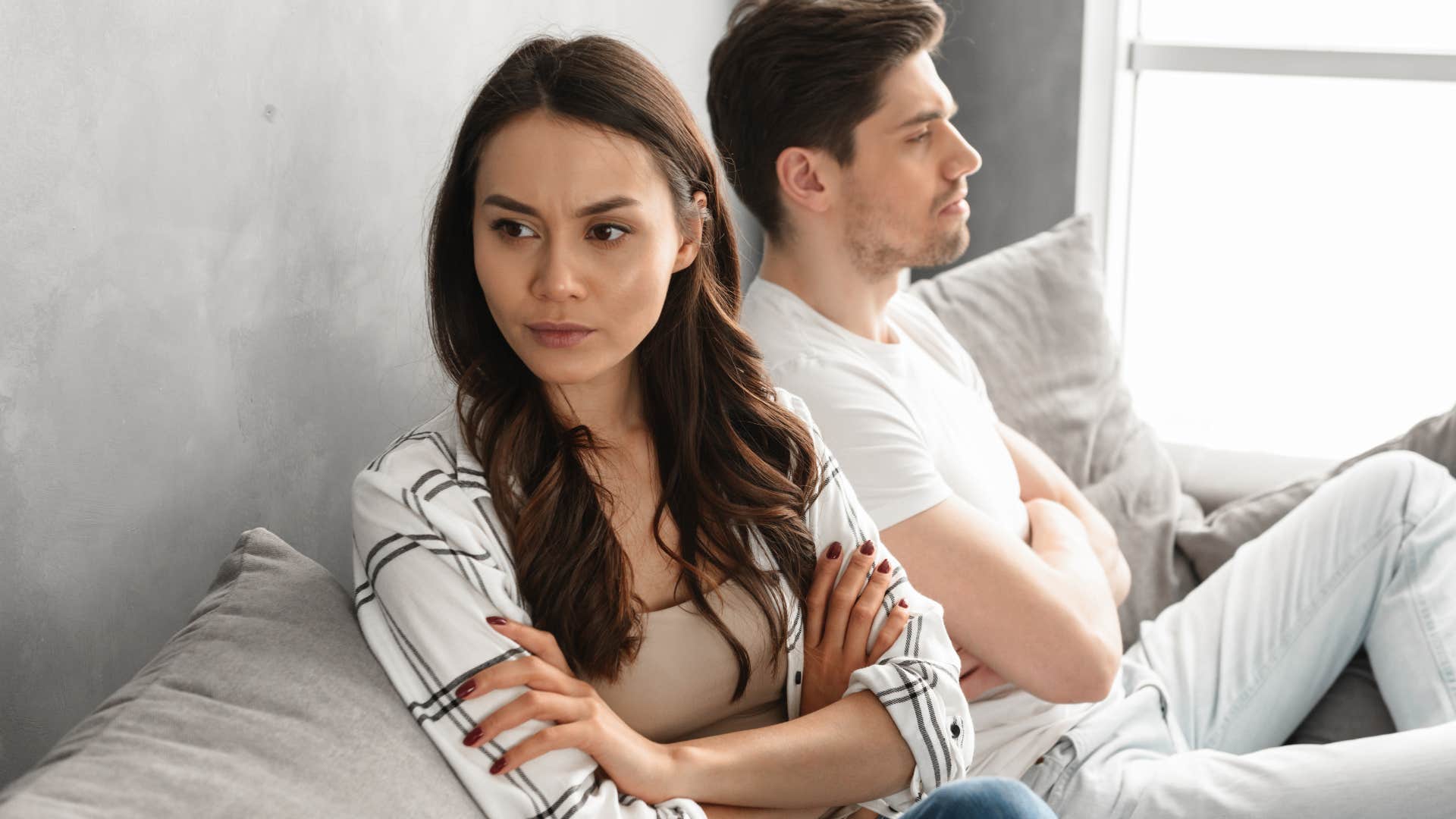 man who doesnt keep promises sitting next to angry woman