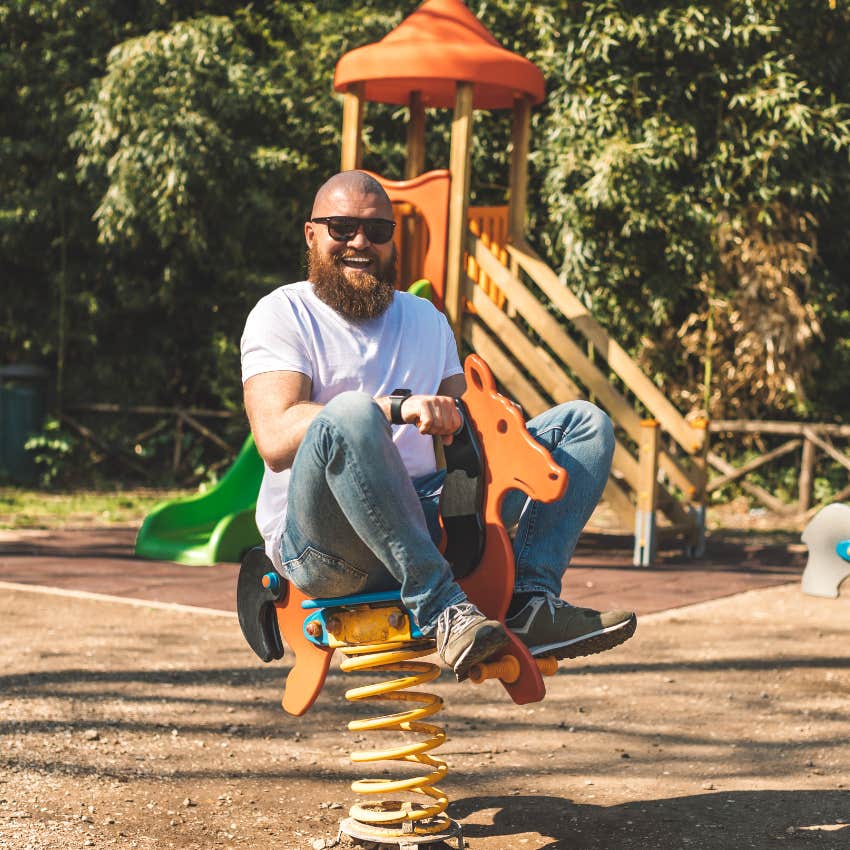 man trying something ridiculous of playing in the park