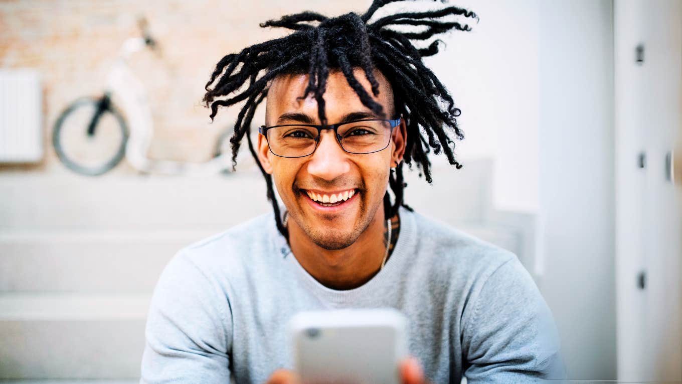 Unusual Text Messages Men Love To Get That Make Them Feel Seen And Desired, According To Experts Man getting a text that makes him feel seen and desired.